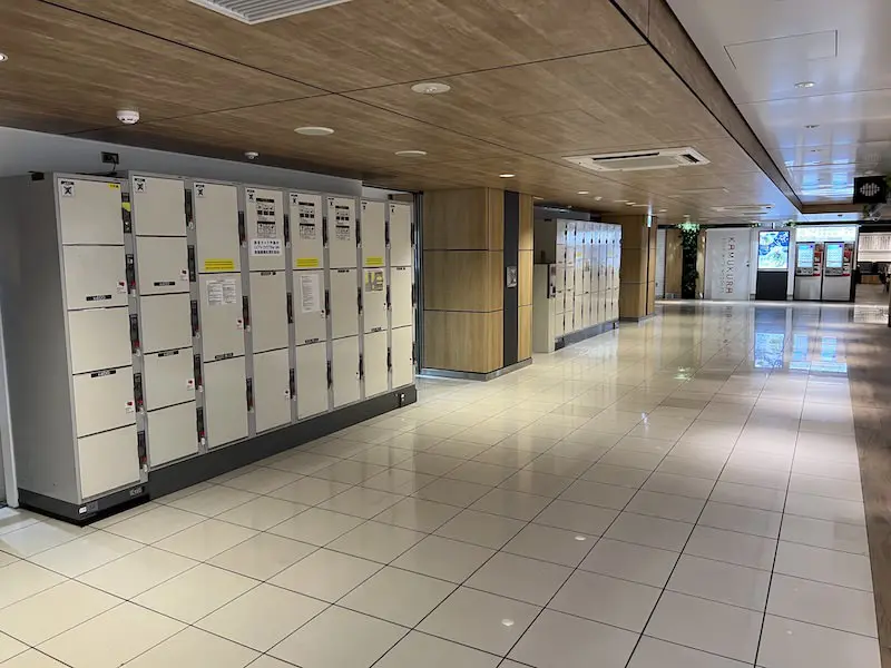 Two coin lockers next to the escalator.