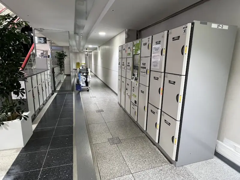 Coin-operated lockers are located across from each other.