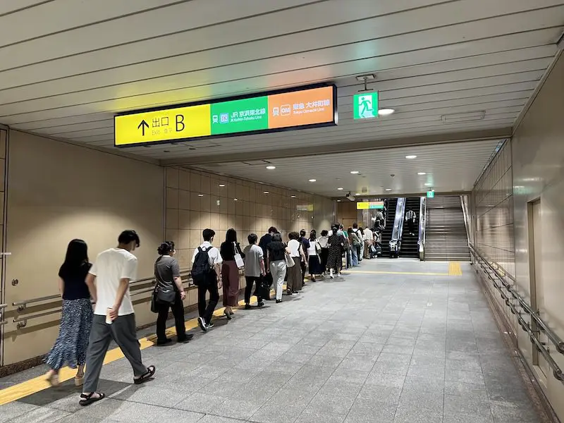 One more escalator level up and there are coin lockers.