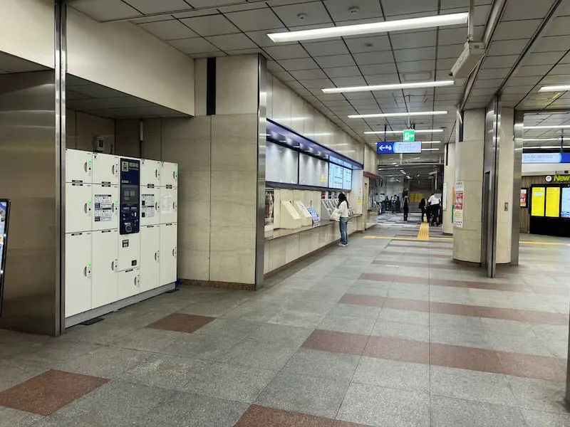 Ticket gate is at the back of the ticket office