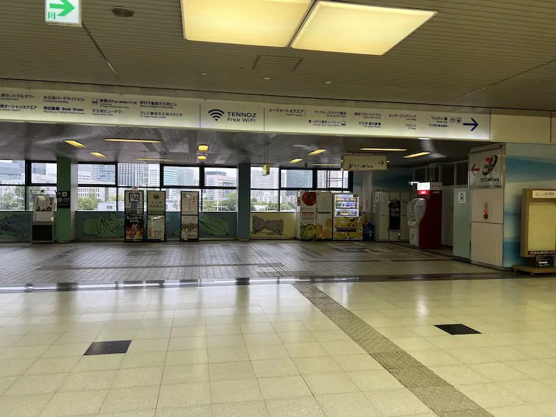 Exiting the Tokyo Monorail Central Exit ticket gate. Coin lockers can be seen at the ATM on the right.