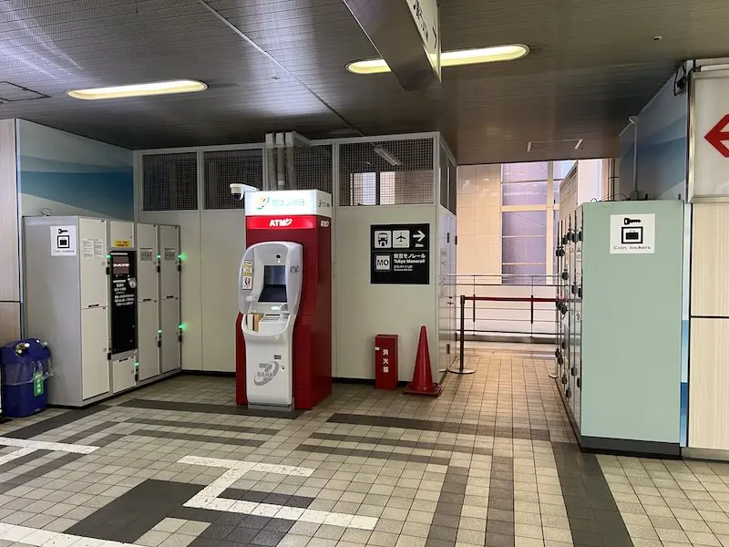 Coin-operated lockers at Tokyo Monorail Tennozu Isle Station, located across from a Seven Bank ATM