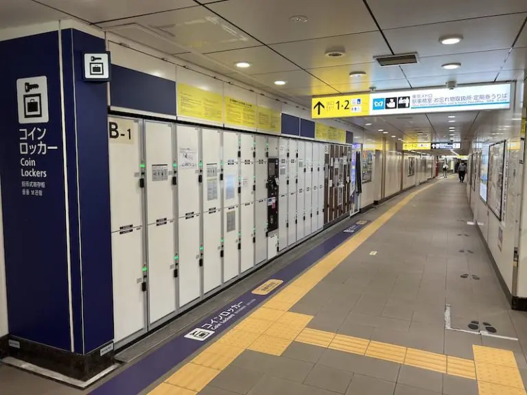 Turn left and coin lockers appear in front of the station office.